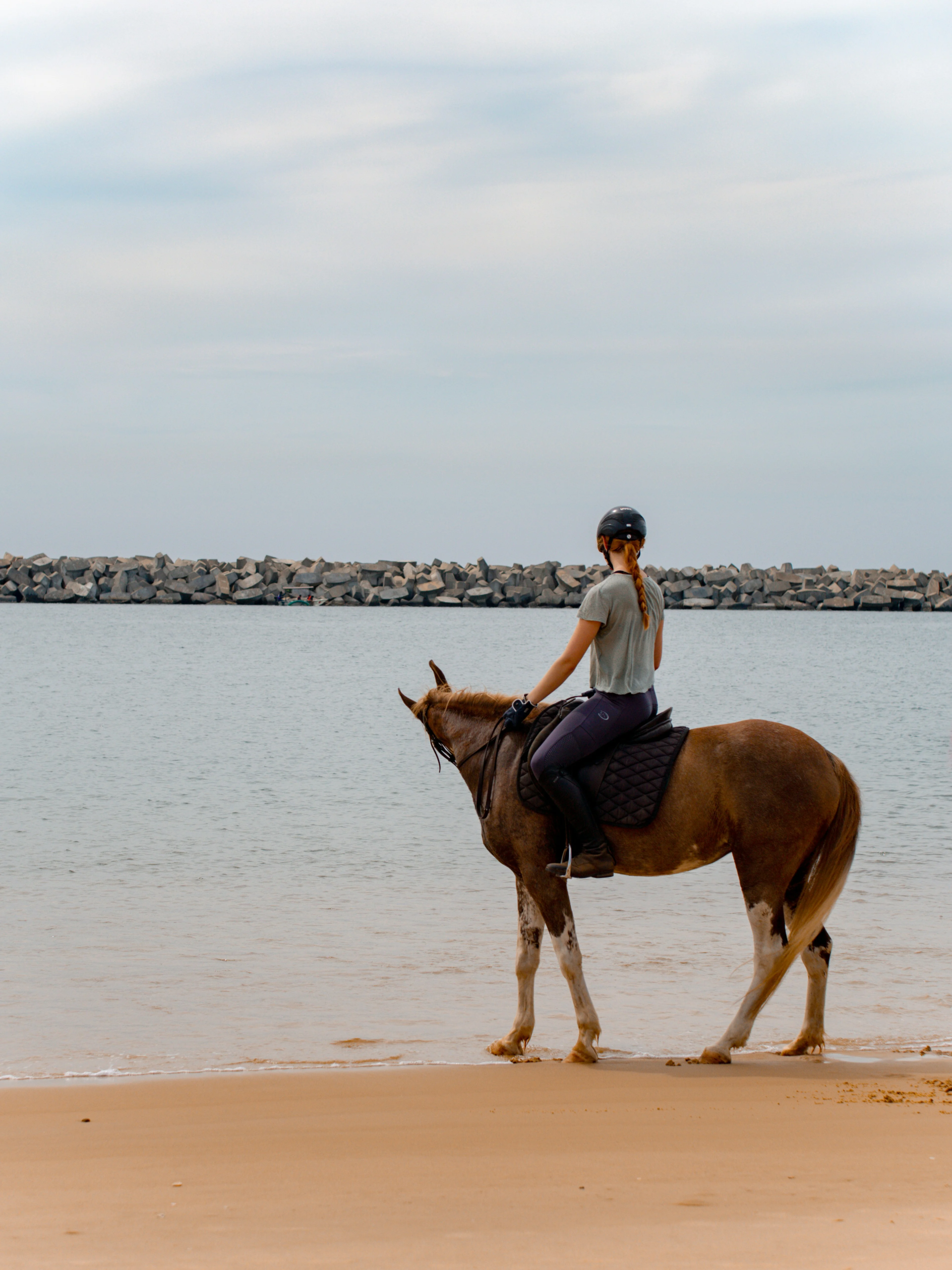 a young girl riding a horse